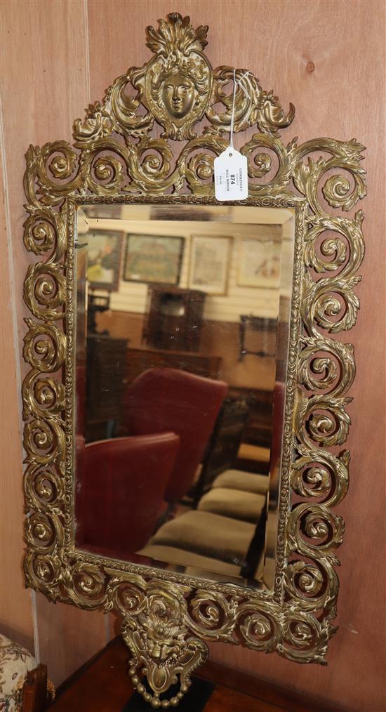 A gilt metal wall mirror.